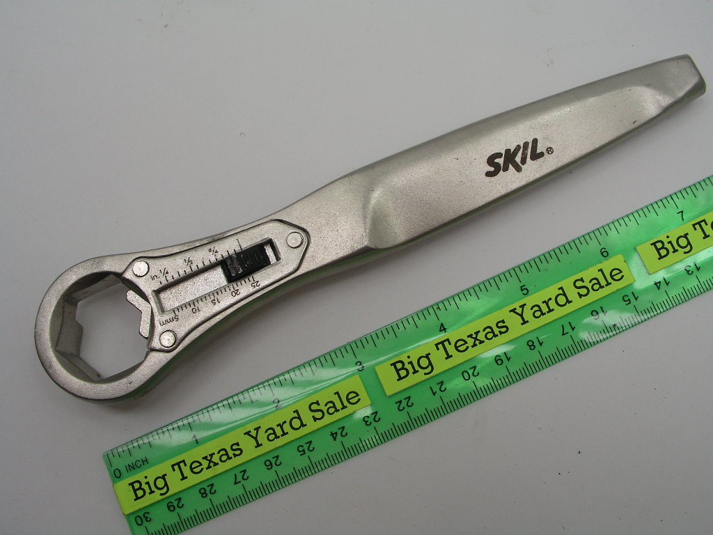 OLYMPUS DIGITAL CAMERA Skil Universal Adjustable Wrench - Image 1